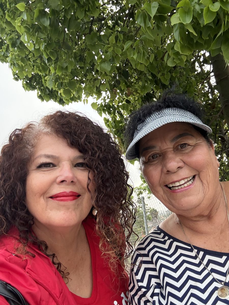 Zenaida Rosario with a community member in San Ysidro