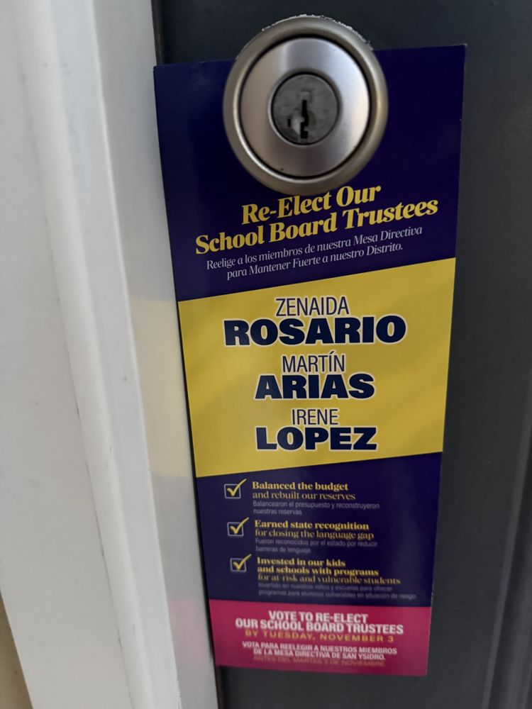 Door hanger distributed in San Ysidro listing the record of Rosario, Arias and Lopez in English and Spanish