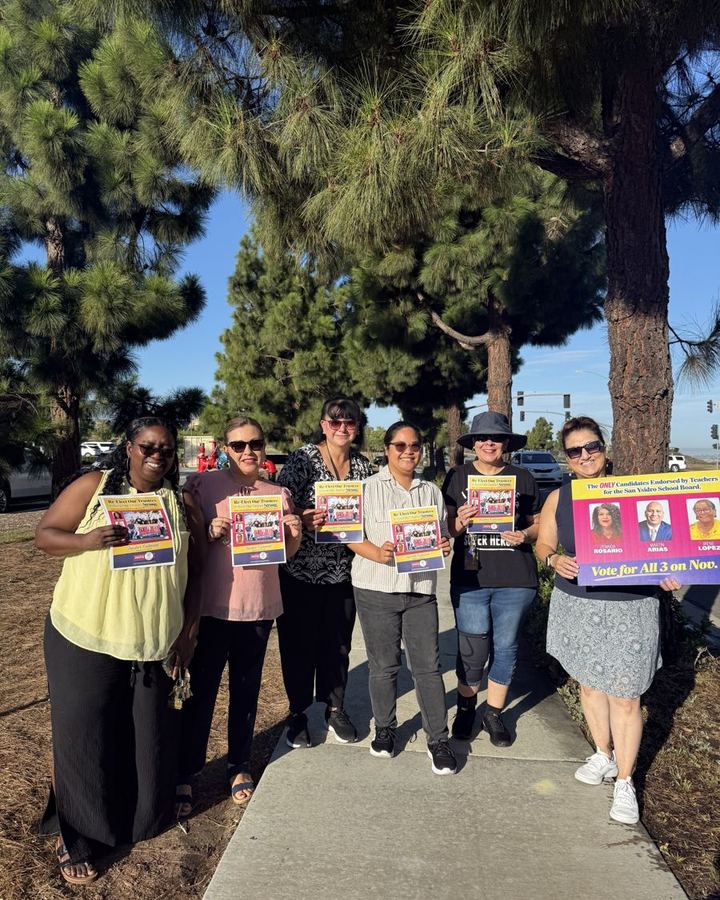 Canvassers walking into a San Ysidro neighborhood with literature